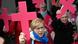 Women protesting with pink crosses outside the assembly's venue in Frankfurt on March 9, 2023 Women protesting with pink crosses outside the assembly's venue in Frankfurt on March 9, 2023