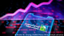 May 12, 2022, Asuncion, Paraguay: Illustration: In-camera multiple exposure image shows logo of Saudi Arabian Oil Company (Aramco) on a smartphone backdropped by abstract presentation of rising line chart and numbers. (Credit Image: Â© Andre M. Chang/ZUMA Press Wire