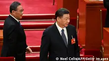12.03.2023 *** China's President Xi Jinping (R) and Premier Li Qiang arrive for the fifth plenary session of the National People's Congress (NPC) at the Great Hall of the People in Beijing on March 12, 2023. (Photo by NOEL CELIS / AFP) (Photo by NOEL CELIS/AFP via Getty Images)