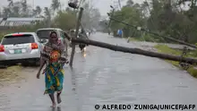 12.03.2023**This handout photograph taken and distributed by UNICEF on March 12, 2023 shows a woman walking along a street damaged by the impact of Cyclone Freddy in the city of Quelimane. - Tropical cyclone Freddy, which made landfall in Mozambique overnight from March 11, 2023 to March 12, 2023 for the second time in two weeks, killed at least one person on its return and displaced dozens, according to an initial report from local authorities on March 12, 2023.
Freddy had already killed 10 people in the southern African country during his first visit at the end of February and 17 in total in Madagascar where he also struck twice, describing a looping trajectory rarely known to meteorologists. (Photo by Alfredo ZUNIGA / UNICEF / AFP) / RESTRICTED TO EDITORIAL USE - MANDATORY CREDIT AFP PHOTO /UNICEF/Alfredo Zuniga - NO MARKETING NO ADVERTISING CAMPAIGNS - DISTRIBUTED AS A SERVICE TO CLIENTS