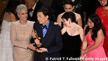 TOPSHOT - US actress Jamie Lee Curtis (L) and US actor James Hong walk onstage after winning the Oscar for Best Picture for Everything Everywhere All at Once during the 95th Annual Academy Awards at the Dolby Theatre in Hollywood, California on March 12, 2023. (Photo by Patrick T. Fallon / AFP) (Photo by PATRICK T. FALLON/AFP via Getty Images)