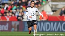 BIELEFELD, GERMANY - APRIL 09: Dzsenifer Marozsan of Germany runs with the ball during the FIFA Women's World Cup 2023 Qualifier group H match between Germany and Portugal at Schueco Arena on April 09, 2022 in Bielefeld, Germany. (Photo by Christof Koepsel/Getty Images)