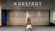 Passers-by walk past a closed entrance to the Karstadt shop at Munich Central Station. Passers-by walk past a closed entrance to the Karstadt shop at Munich Central Station.