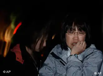地震后受到惊吓的一位日本女性