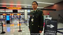 --FILE--A custom officer waits to help foreign foreigners to experience visa-free access at Shenyang Airport in Shenyang city, northeast China's Liaoning province, 1 January 2013. The number of Chinese border ports that allow eligible international travelers to transit within 144 hours without a visa will increase to 27 from Dec. 1, said the National Immigration Administration (NIA). It allows passengers from 53 countries or regions to transit for no more than 144 hours (6 days) without holding a visa. In the meantime, in total 30 cities foreign tourists can transit for no more than 72 hours (3 days) without holding a visa. *** Local Caption *** fachaoshi