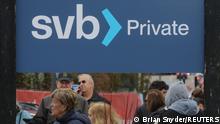 March 13, 2023**Customers wait in line outside a branch of the Silicon Valley Bank in Wellesley, Massachusetts, U.S., March 13, 2023. REUTERS/Brian Snyder