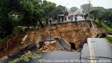 A road connecting the two cities of Blantyre and Lilongwe is seen damaged following heavy rains caused by Tropical Cyclone Freddy in Blantyre, Malawi Tuesday, March 14 2023. The unrelenting cyclone that is currently battering southern Africa has killed at more than 50 people in Malawi and Mozambique since it struck the continent for a second time on Saturday night, authorities in both countries have confirmed. (AP Photo/Thoko Chikondi)