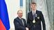 Russian athlete Vladislav Larin poses with President Vladimir Putin Russian athlete Vladislav Larin poses with President Vladimir Putin