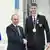 Russian athlete Vladislav Larin poses with President Vladimir Putin