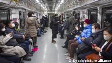 People wearing face masks ride a subway train in Seoul on Jan. 30, 2023. South Korea allowed people the same day to visit most indoor locations, including schools and gyms, without masks amid a downward trend in the COVID-19 pandemic, but the mask mandate remained in place for public transport and locations such as hospitals. (Kyodo) 