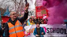 Striking workers on Park lane march to a rally in Trafalgar Square, central London, Wednesday, March 15, 2023 in a long-running dispute over pay. (Aaron Chown/PA via AP)