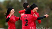 MELBOURNE, AUSTRALIA - MAY 01: Montaha of the Melbourne Victory Afghan Women's Team (R) celebrates with team mates during the Victoria Women's State League 4 West competition match between the Melbourne Victory Afghan Women's Team and the Melton Phoenix at Ron Barassi Senior Reserve on May 01, 2022 in Melbourne, Australia. (Photo by Kelly Defina/Getty Images)