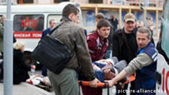 Medics carry victim on stretcher
