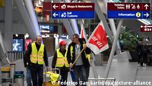 Streikende Flughafenmitarbeiter gehen durch das Terminal. An den beiden größten Flughäfen in Nordrhein-Westfalen, Düsseldorf und Köln/Bonn, haben ganztägige Warnstreiks begonnen. Die Gewerkschaft rief Beschäftigte der Fluggastkontrolle, der Personal-, Waren- und Frachtkontrolle sowie Beschäftigte des öffentlichen Dienstes zu Arbeitsniederlegungen auf.