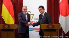 Germany Chancellor Olaf Scholz and Japan Prime Minister Fumio Kishida shake hands during a presser after the summit at the Prime Minister's official residence in Tokyo, Japan, 18 March 2023. Nicolas Datiche/Pool via REUTERS