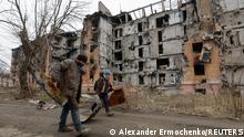16.03.2023
Local residents walk past a multi-storey apartment block, which was destroyed in the course of Russia-Ukraine conflict, in Mariupol, Russian-controlled Ukraine, March 16, 2023. REUTERS/Alexander Ermochenko