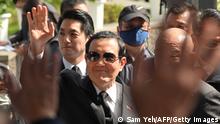 Former president Ma Ying-Jeou (C) waves to relatives as Taipei Mayor Chiang Wan-an (L) follows during a ceremony marking the 76th anniversary of 228 incident at the 228 Peace Park in Taipei on February 28, 2023. - The 228 incident, which took place on February 28, 1947, led to the massacre of thousands of people as security forces violently quashed an anti-government uprising. (Photo by Sam Yeh / AFP) (Photo by SAM YEH/AFP via Getty Images)