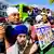 Raman Singh (L) holds a photo of Sikh organizer Amritpal Singh while protesting against the Indian government outside the Indian Consulate in San Francisco on March 20, 2023