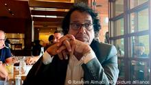 In this photo provided by Ibrahim Almadi, Saad Ibrahim Almadi sits in a restaurant in an unidentified place, in the United States, on August 2021. Saudi Arabia has freed the Saudi-American citizen it had imprisoned more than a year over his old tweets critical of the kingdomâ€™s crown prince. (Ibrahim Almadi via AP)