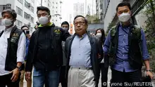 21.03.2023 *** Former Vice-Chairman of the Hong Kong Alliance in Support of Patriotic Democratic Movements of China, Albert Ho, walks after his arrest by police, in Hong Kong, China March 21, 2023. REUTERS/Tyrone Siu