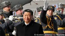 Chinese President Xi Jinping walks past honour guards and members of a military band during a welcoming ceremony upon his arrival at an airport in Moscow, Russia, March 20, 2023. Kommersant Photo/Anatoliy Zhdanov via REUTERS RUSSIA OUT. NO COMMERCIAL OR EDITORIAL SALES IN RUSSIA.