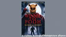 This image released by Fathom Events shows promotional art for the horror film Winnie the Pooh: Blood and Honey. A.A. Milne’s 1926 book, “Winnie-the-Pooh,” with illustrations by E.H. Shepard, became public domain on January 1 when the copyright expired. (Fathom Events via AP)