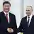 Xi Jinping and Vladmir Putin shaking hands