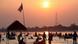 Tourists enjoy the low running Mekong River at sunset on the border of the two Southeast Asian nations Tourists enjoy the low running Mekong River at sunset on the border of the two Southeast Asian nations