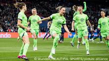 Dominique Janssen roars in delight as her teammates jump in joy
