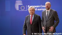UN General secretary Antonio Guterres (L) and European Council President Charles Michel arrive for a European council summit, in Brussels, on March 23, 2023. (Photo by NICOLAS MAETERLINCK / Belga / AFP) / Belgium OUT