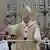 Pope Benedict XVI blesses the faithful upon his arrival in St. Peter's square