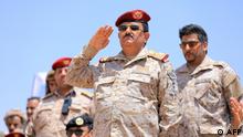 Yemeni Defence Minister Lieutenant General Mohsen Mohammed Al-Daeri (C) attends a military parade of fighters loyal to the Saudi-backed government during a graduation ceremony of officers and the completion of specialised military courses, in the country's northeastern province of Marib, on March 17, 2023. (Photo by AFP)