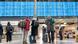 Passengers look to see if their flights will be departing from Munich Airport Passengers look to see if their flights will be departing from Munich Airport