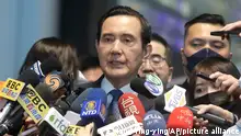 Former Taiwan President Ma Ying-jeou answers to press before leaving for China at Taoyuan International Airport in Taoyuan City, Northern Taiwan, Monday, March 27, 2023. Ma departed for China Monday on a 12-day tour, a day after Taiwan lost another one of its diplomatic allies to China. (AP Photo/Chiang Ying-ying)