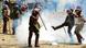 A riot police officer kicks a teargas canister lobbed to disperse supporters of Kenya's opposition leader Raila Odinga A riot police officer kicks a teargas canister lobbed to disperse supporters of Kenya's opposition leader Raila Odinga