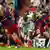 Real Madrid's Lassana Diarra, center, battles with Barcelona's Seydou Keita