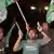 Palestinians wave flags and chant slogans in support of a reconciliation between the rival Fatah and Hamas movements