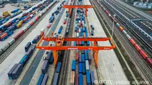 GANZHOU, CHINA - DECEMBER 14, 2022 - Aerial photo shows a Longmen crane loading and unloading containers at Ganzhou International Land Port in Ganzhou City, Jiangxi Province, China, Dec. 14, 2022. In recent years, Ganzhou International Land Port has been closely built to become the vanguard of integrating into the Belt and Road Initiative and the Guangdong-Hong Kong-Macao Greater Bay Area.