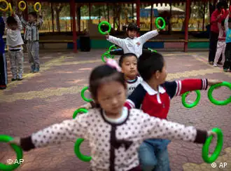 Children dance during their daily afternoon exercise at a kindergarten in Beijing, China, Thursday, April 28, 2011. A national census carried out late last year showed a sharp drop in the number of young people in China, with those under age 14 now accounting for 16.6 percent of the country's 1.34 billion people, down 6.3 percentage points from 2000. (AP Photo/Alexander F. Yuan)