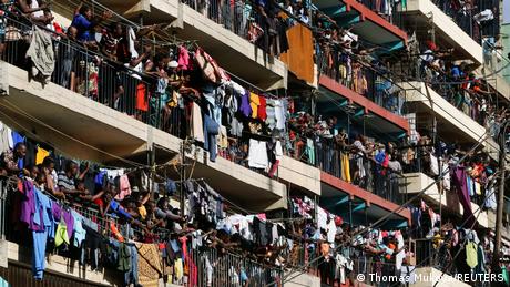 In Mathare, Nairobi, residents gather on the balconies to watch the demonstration