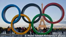 FILE - The Olympic rings are set up at Trocadero plaza that overlooks the Eiffel Tower, a day after the official announcement that the 2024 Summer Olympic Games will be in the French capital, in Paris, France, Thursday, Sept. 14, 2017. The governments of more than 30 nations released a letter Monday, Feb. 20, 2023, calling on the IOC to clarify the definition of “neutrality” as it seeks a way to allow Russian and Belarusian athletes back into international sports and, ultimately, next year's Paris Olympics.(AP Photo//Michel Euler, File)