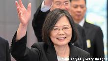 Taiwan President Tsai Ing-wen waves as she arrives at the boarding gate of the international airport in Taoyuan on March 29, 2023. - Tsai was due to leave for the United States on March 29, a stop on her way to firm ties with Guatemala and Belize after China snapped up another of the self-ruled island's few diplomatic allies last week. (Photo by Sam Yeh / AFP) (Photo by SAM YEH/AFP via Getty Images)