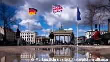 28/03/2023**From left, the German flag, the Union Jack flag and the European Union flag wave in front of the Brandenburg Gate at the eve of the visit of King Charles III at the German capital, in Berlin, Tuesday, March 28, 2023. Britain's King Charles III and Camilla, the Queen Consort, will make an official visit to Germany from March 29 to 31, 2023. (AP Photo/Markus Schreiber)
