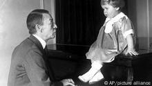 World famous Russian composer and pianist Sergei Rachmaninoff plays for his granddaughter Sophie , in New York, USA, Nov. 15, 1927. (AP Photo)
