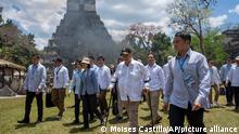 Taiwan's President Tsai Ing-wen, center left, and Guatemala's President Alejandro Giammattei, walk to a staging area during their visit to the Mayan site Tikal, in Peten, Guatemala, Saturday, April 1, 2023. Tsai is in Guatemala for an official three-day visit. (AP Photo/Moises Castillo)