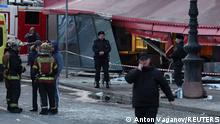 Investigators and members of emergency services work at the site of an explosion in a cafe in Saint Petersburg, Russia April 2, 2023. REUTERS/Anton Vaganov