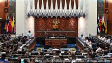 (230224) -- KUALA LUMPUR, Feb. 24, 2023 (Xinhua) -- Malaysian Prime Minister Anwar Ibrahim proposes the national budget at the parliament house in Kuala Lumpur, Malaysia, Feb. 24, 2023. The Malaysian government led by Prime Minister Anwar Ibrahim on Friday proposed a 388.1 billion ringgit (87.5 billion U.S. dollars) national budget aimed at helping the country resolve a number of domestic issues. Anwar, who is also the finance minister, said the budget will focus on addressing the high cost of living, further strengthening the social safety net and enhancing the micro, small and medium enterprises' ecosystem, being guided by six core values, namely sustainability, prosperity, innovation, respect, trust, and lastly, care and compassion. (Malaysia's Department of Information/Handout via Xinhua)