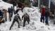 Soldiers clear snow from an avalanche near a mountain pass in India's Sikkim state Soldiers clear snow from an avalanche near a mountain pass in India's Sikkim state