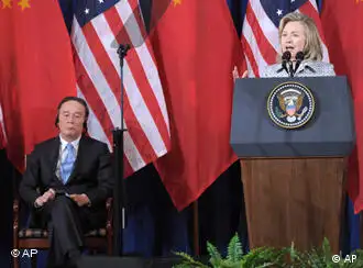 Secretary of State Hillary Rodham Clinton speaks as Chinese Vice Premier Wang Qishan, center, and Chinese State Counselor Dai Bingguo, left, listen during the opening session of the joint meeting of the U.S.-China Strategic and Economic Dialogue (S&ED), Monday, May 9, 2011, at the Interior Department in Washington. (AP Photo/Susan Walsh)