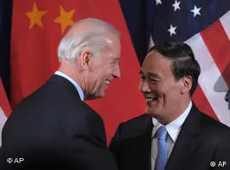 Vice President Joe Biden greets Chinese Vice Premier Wang Qishan during the opening session of the joint meeting of the U.S.-China Strategic and Economic Dialogue (S&ED), Monday, May 9, 2011, at the Interior Department in Washington. (AP Photo/Susan Walsh)